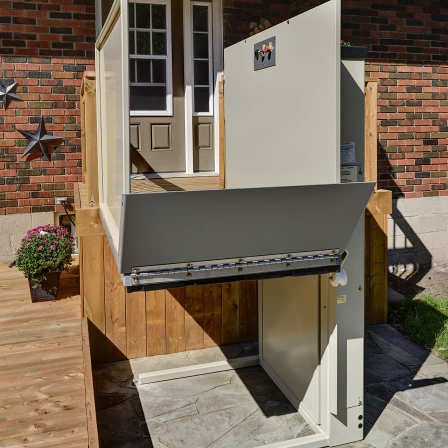 Multilift unenclosed vertical platform lift connecting residential deck to ground level entrance